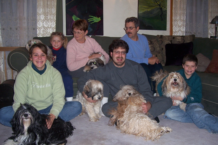 Family of six with their six Tibetan Terriers